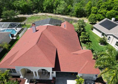 Aerial shot of a red shingle roof, showing preparation for solar panel installation, courtesy of Smart Volt Solutions.