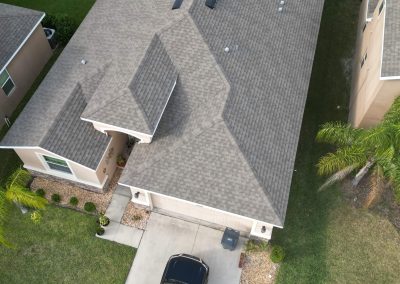 Overhead view of a residential property showcasing a clean, well-structured roof ideal for solar panel installation.