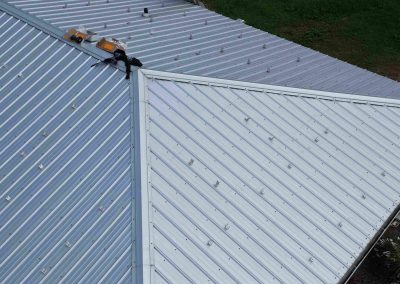 Close-Up of Solar Panel Mounting Brackets on Metal Roof