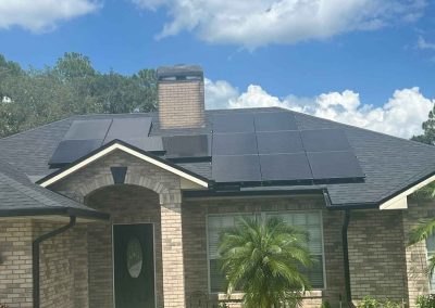 Front view of a house with a newly completed installation, featuring updated exterior details, clean finishes, and a refreshed look.