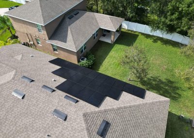 Aerial view of a residential roof with newly installed solar panels, showcasing an efficient solar energy setup.