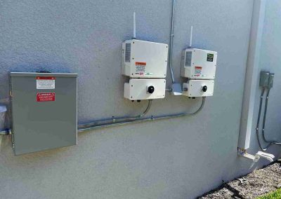 Solar Inverters and Electrical Panel on Exterior Wall