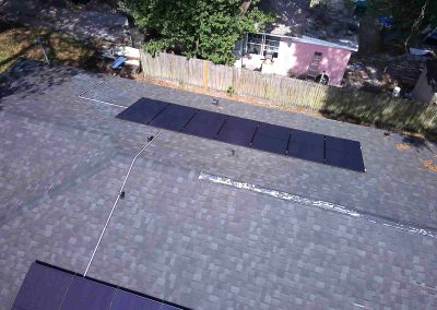 Residential Roof with Dual Solar Panel Installations