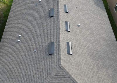 Close-up aerial view of a residential roof inspected for upcoming solar panel installation by Smart Volt Solutions.