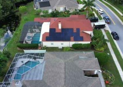 Aerial view of a completed solar panel installation on a residential roof by Smart Volt Solutions, with a focus on sustainable energy and clean living.