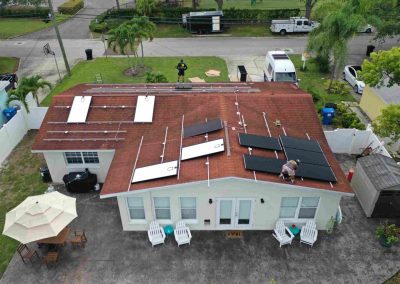 Solar Panel Installation Progress on Red Tile Roof