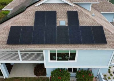 A top-down view of a residential roof showcasing newly installed solar panels by Smart Volt Solutions.