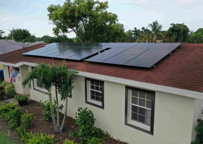 Solar Panels on Home Roof with Lush Landscaping