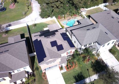 Solar Panels on Two-Story Home with Backyard View