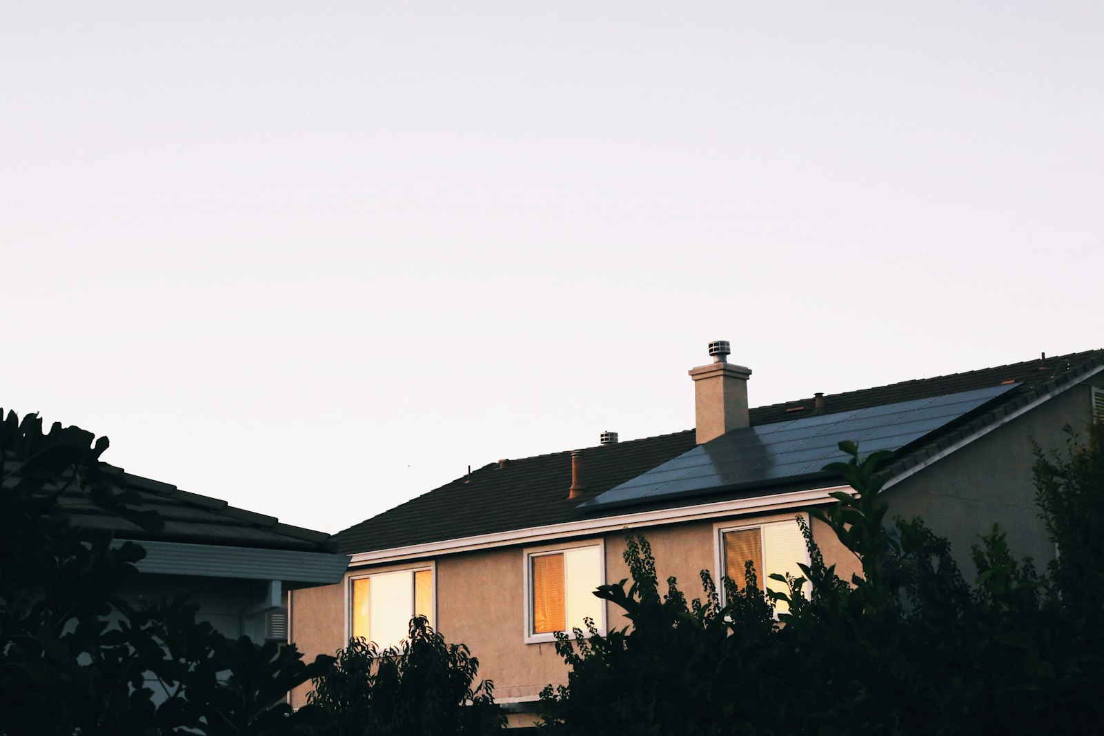 Home with a fully installed rooftop solar panel system, representing a prepaid solar lease